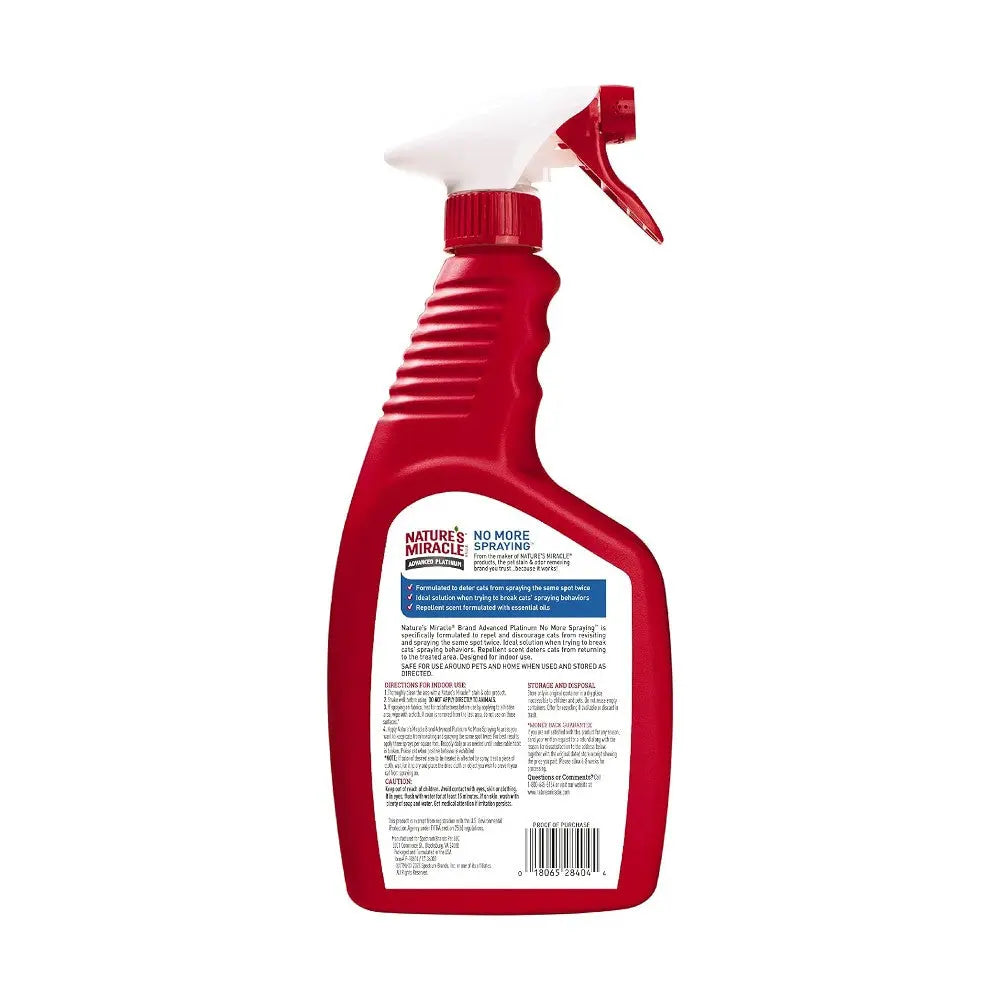 Nature's Miracle No More Spraying pet odor eliminator spray bottle with clear label and red trigger.
