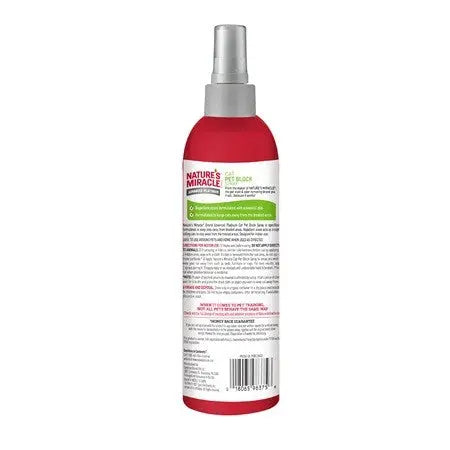 Nature's Miracle pet stain and odor remover spray bottle with clear instructions and ingredients listed.
