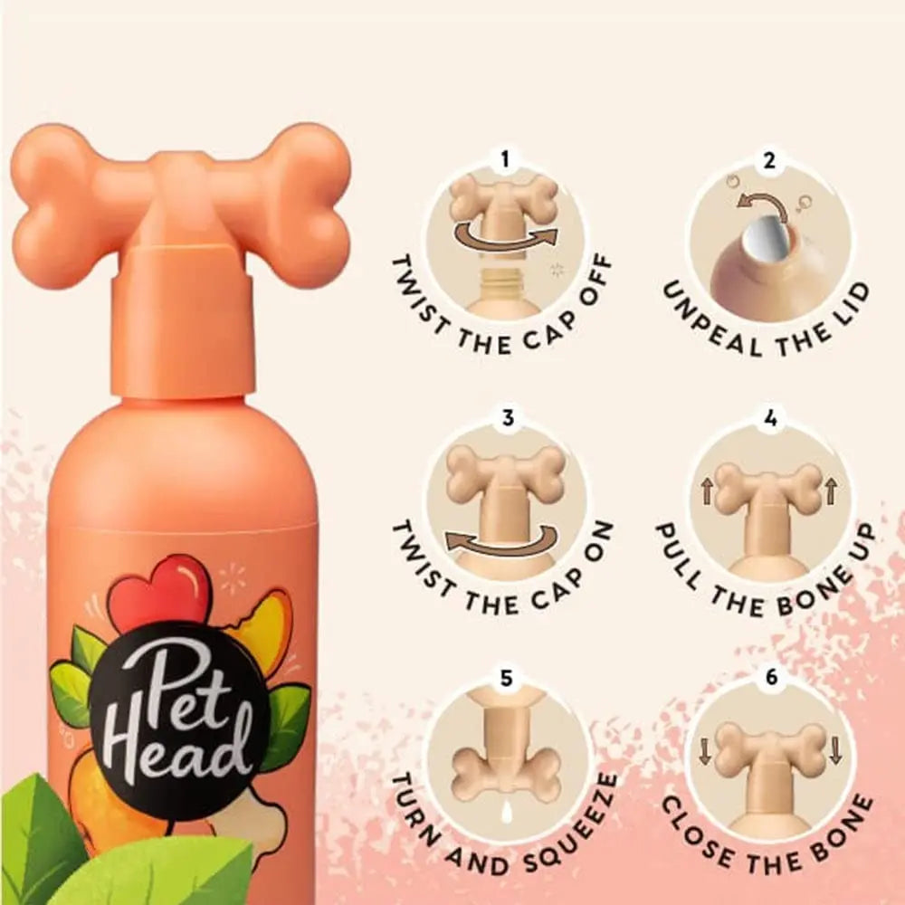 Pet Head dog grooming spray bottle with step-by-step usage instructions and a playful bone-shaped cap.