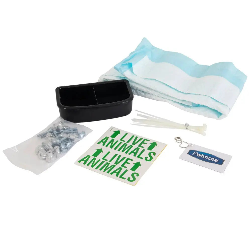 Petmate animal transport kit with supplies, including a container, labels, and bedding for safe travel.