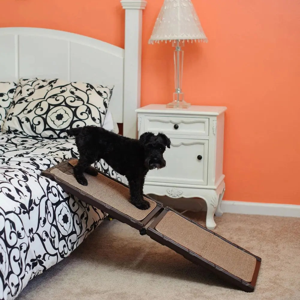 Dog ramp for easy bed access, featuring a sturdy design and textured surface for safety.