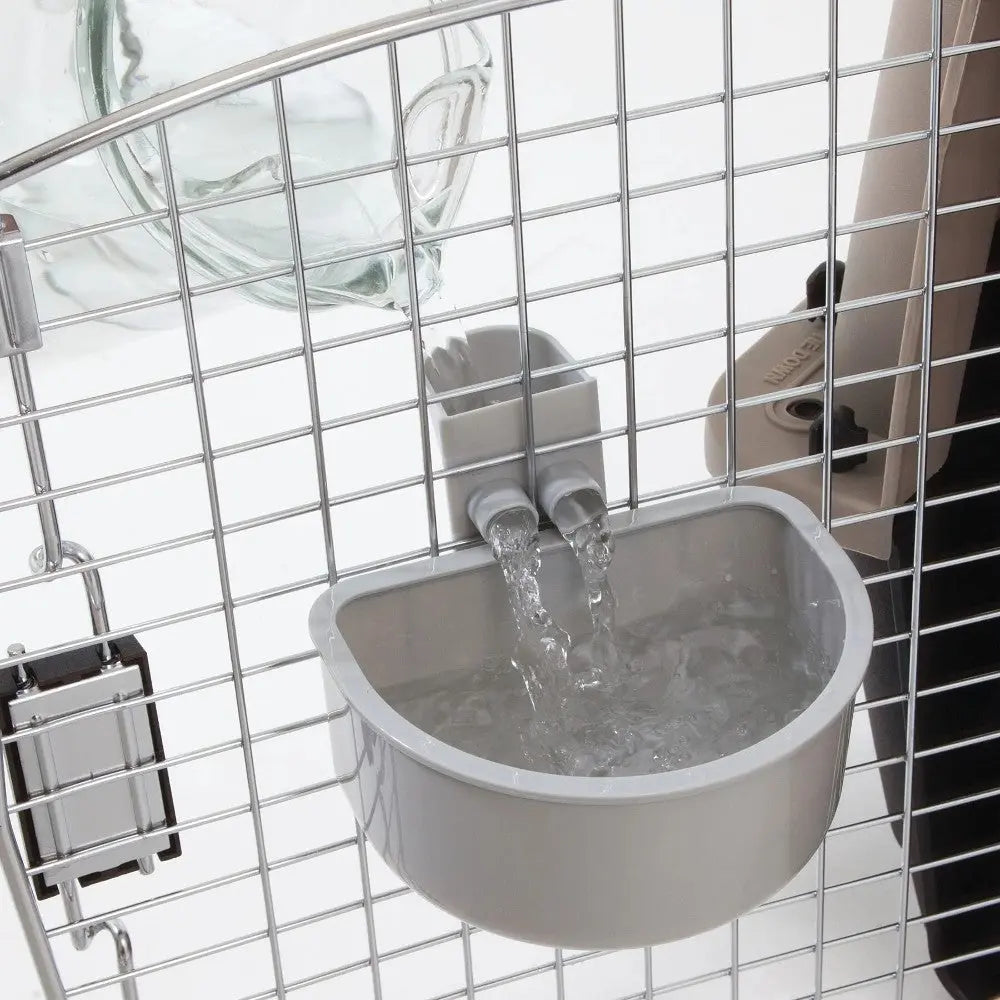 Automatic water bowl for pets, designed for easy hydration in kennels or cages.