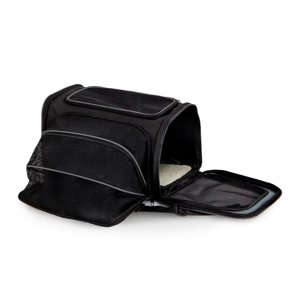 Black pet carrier with mesh panels and a zippered opening for easy access and ventilation.