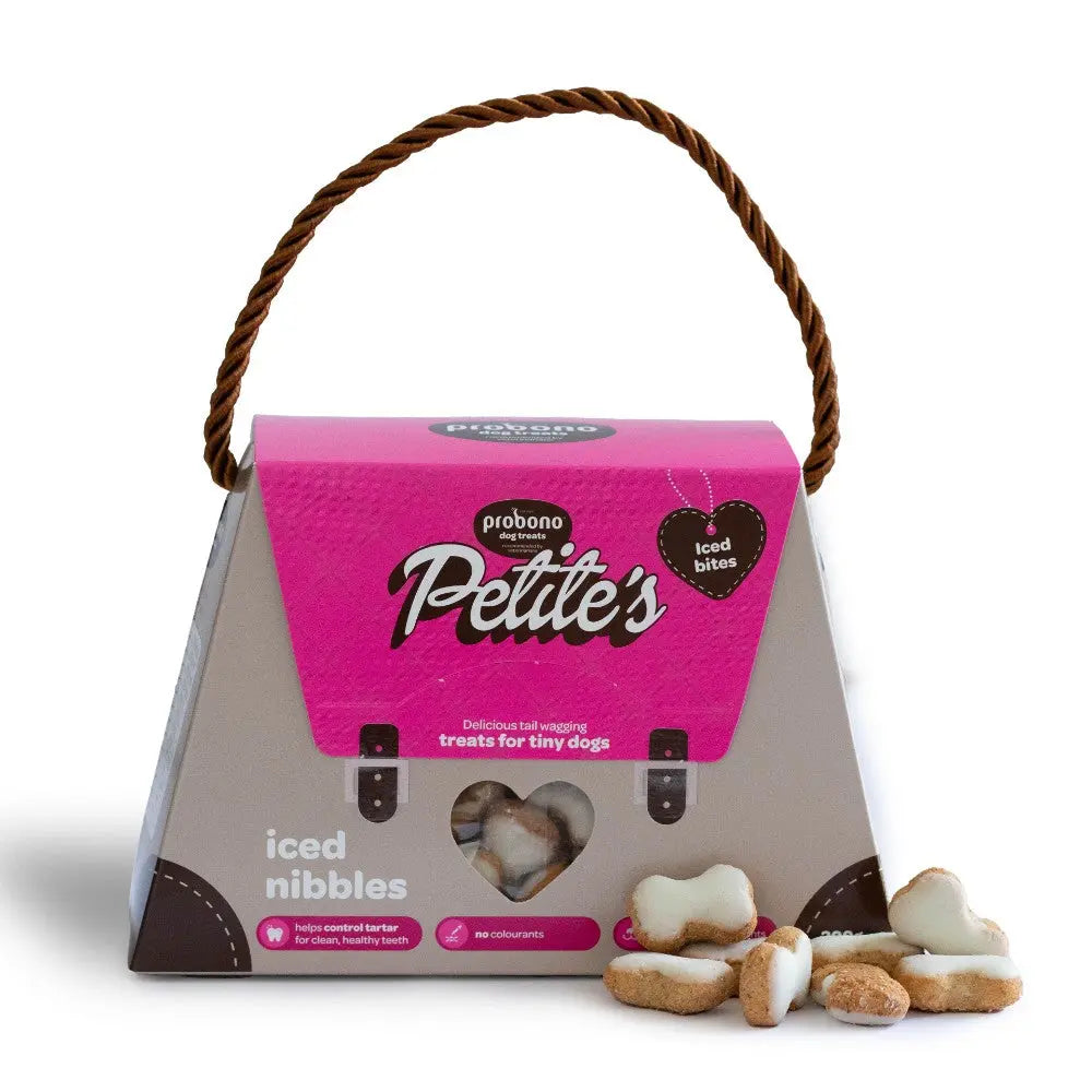 Petite's iced nibbles treat bag for tiny dogs, featuring a stylish handle and tasty snacks.