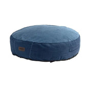 Round blue pet bed with a soft fabric cover for comfortable lounging.