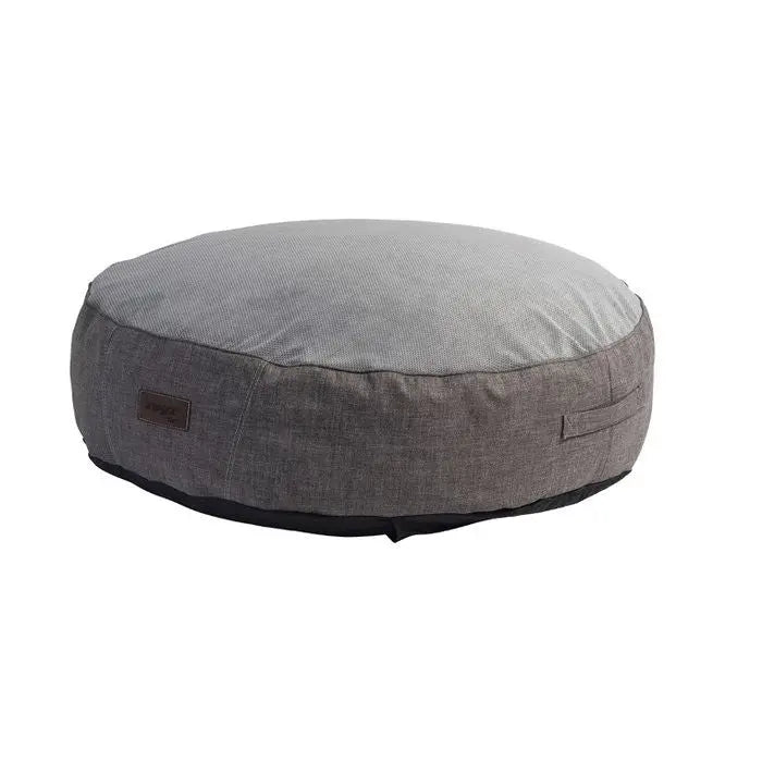 Cozy round pet bed in gray fabric, perfect for dogs and cats to relax and sleep comfortably.