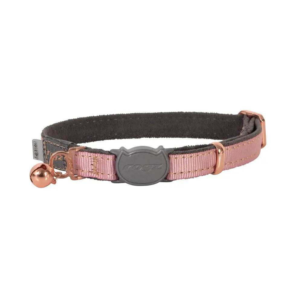 Pink cat collar with bell and adjustable strap for comfort and style.