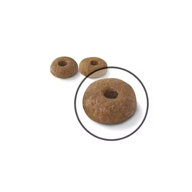 Brown pet food kibble with a unique donut shape for optimal nutrition and easy digestion.