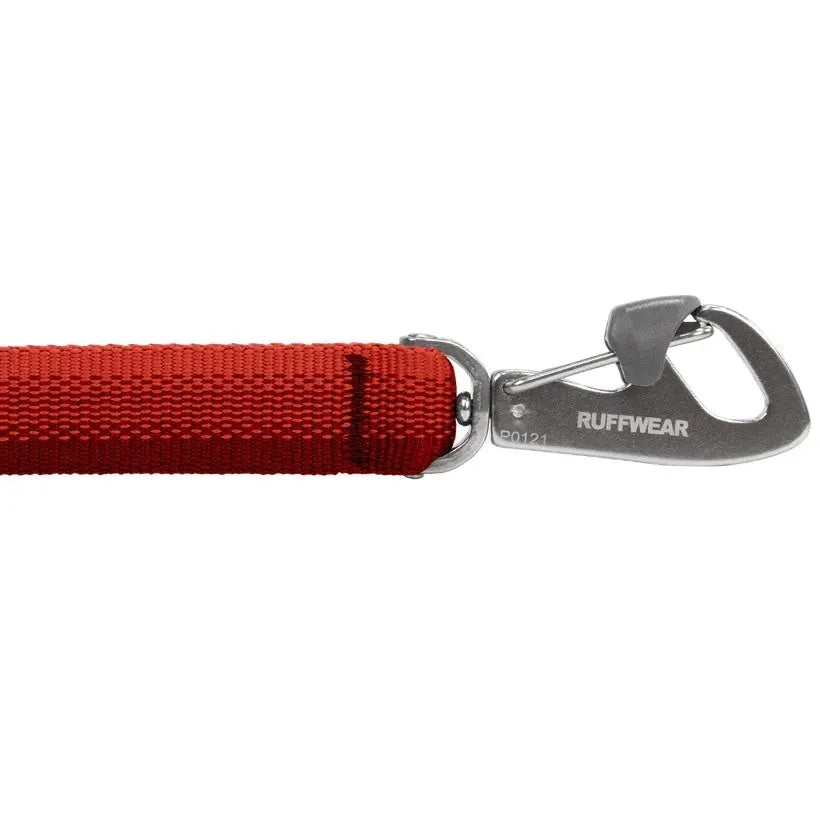 Durable red dog leash with a secure metal clip for safe outdoor adventures.