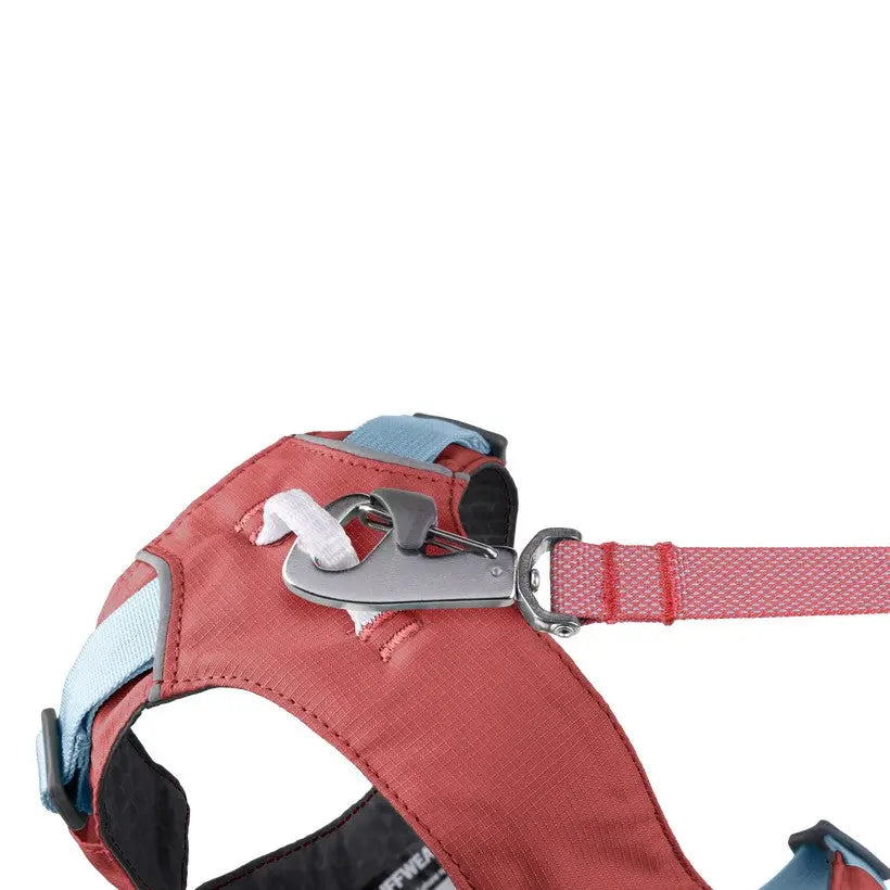 Durable dog harness with adjustable straps and metal clip for secure leash attachment.
