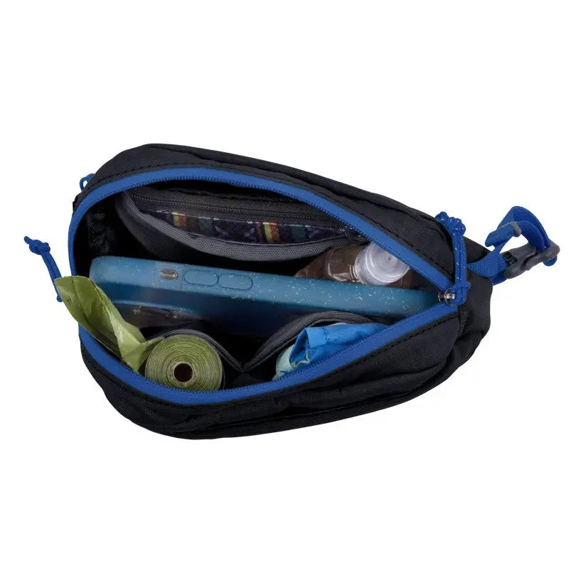 Compact black bag with blue accents, filled with essentials like a water bottle and yoga mat.