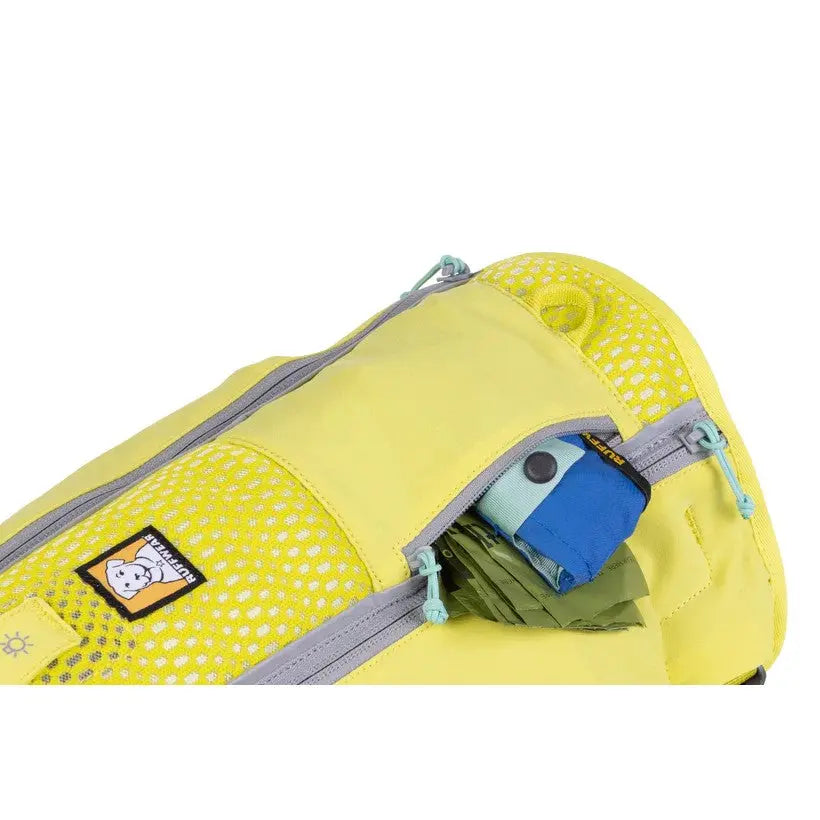 Yellow pet backpack with mesh pockets and zippered compartments for easy storage and access.