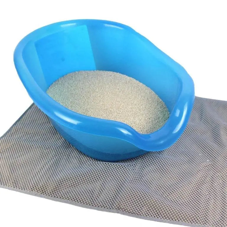Blue litter box filled with clean cat litter on a textured mat for easy pet care.