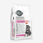 Premium puppy food bag with 31% protein, maize-free formula, and a cute puppy image on the packaging.