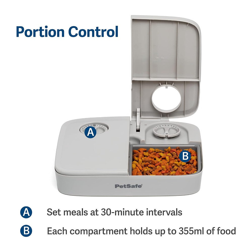 PetSafe 2 Meal Pet Feeder - lifestyle image with pet online in South Africa