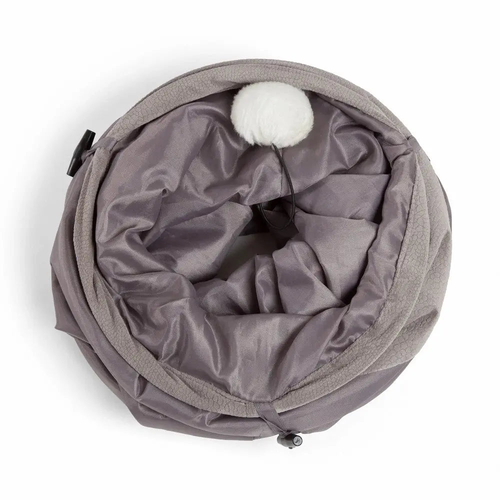 Cozy gray pet bed with a soft interior and playful pom-pom for added comfort and fun.