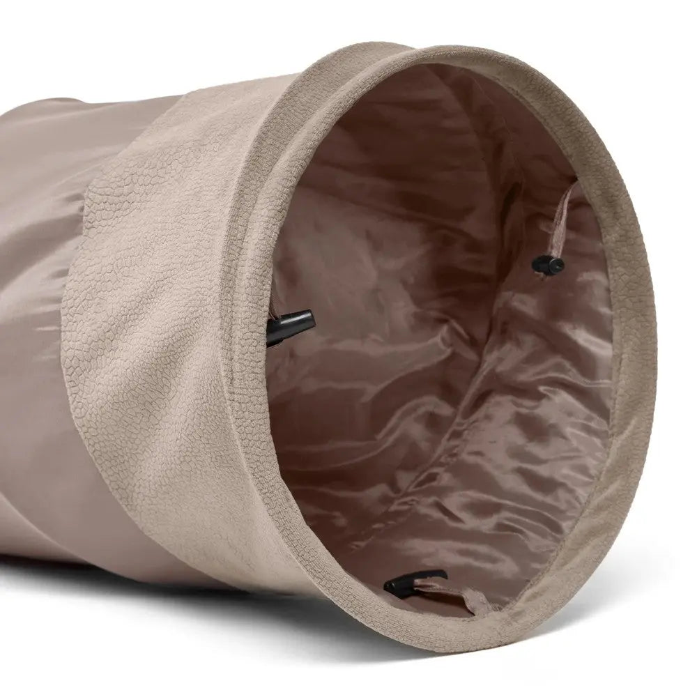 Soft beige storage bag with a drawstring closure, perfect for organizing and decluttering spaces.
