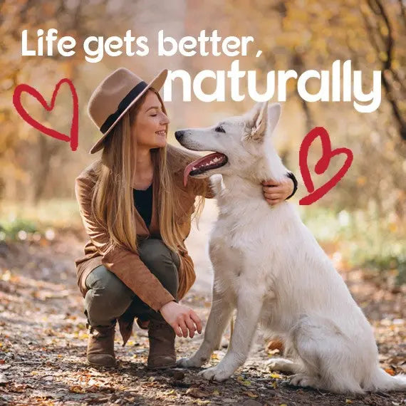 Woman enjoying nature with her dog, promoting a natural lifestyle and companionship.