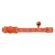 Orange dog collar with a bell and playful dog pattern for pet identification and style.