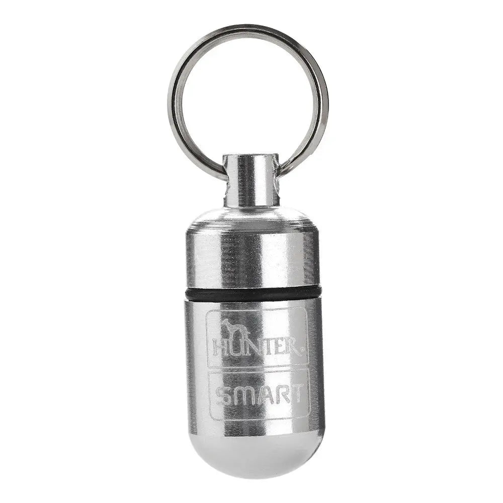 Stainless steel keychain capsule for storing small items securely and conveniently.