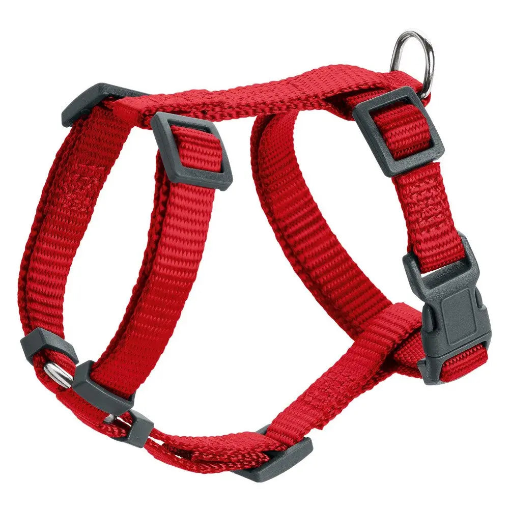 Red dog harness with adjustable straps and metal D-ring for leash attachment.