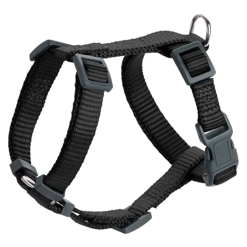Black adjustable dog harness with sturdy clips and D-ring for leash attachment.