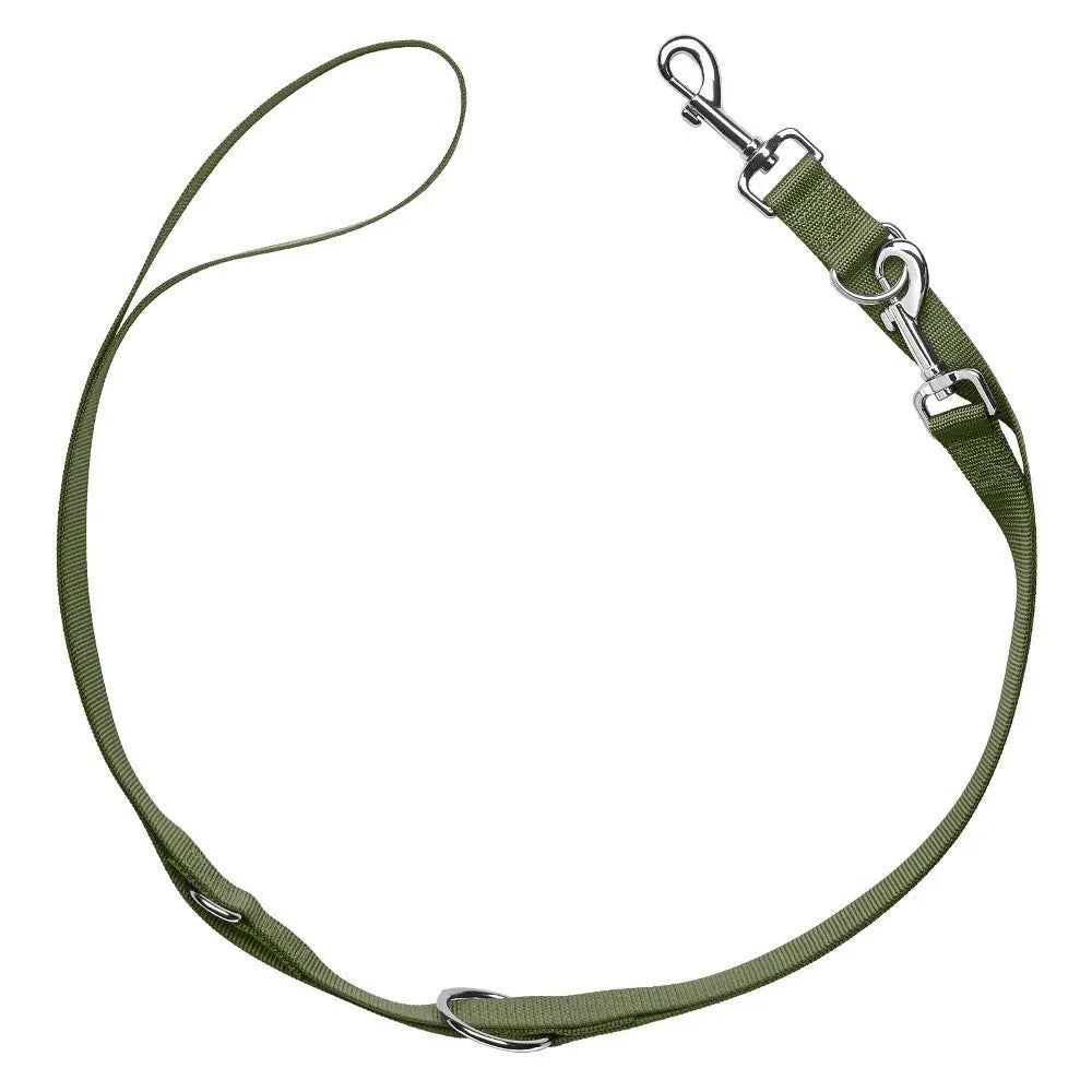 Durable green dog leash with adjustable clips for versatile use and comfort during walks.
