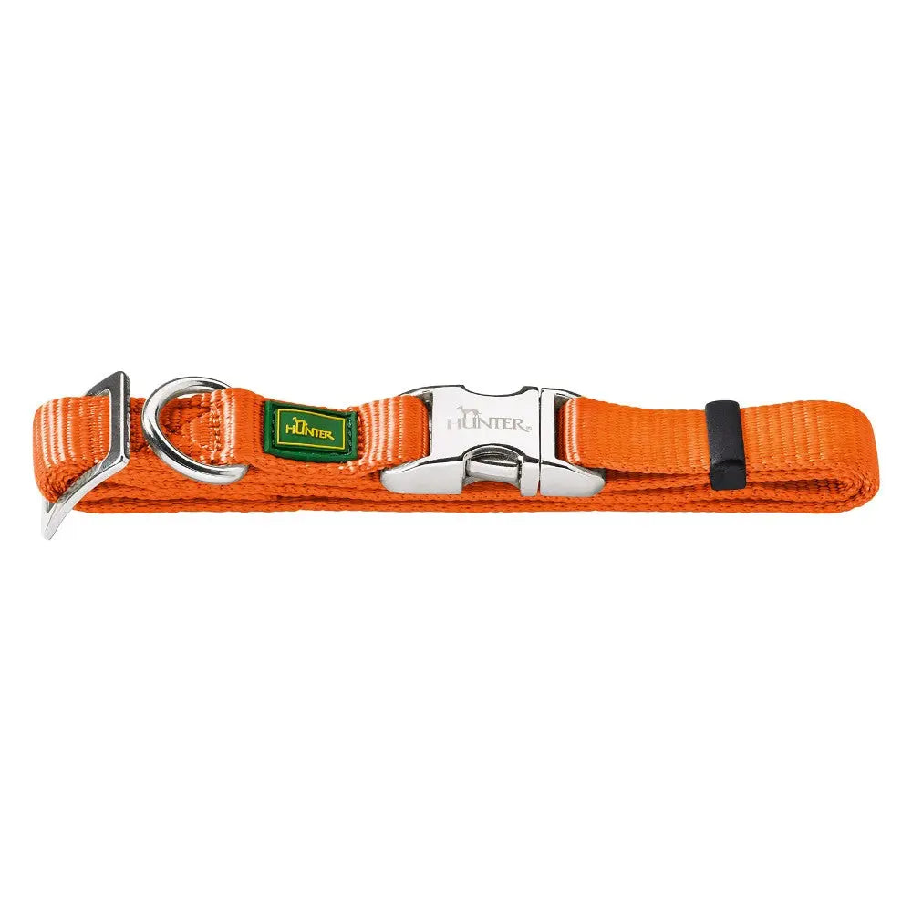 Durable orange dog collar with metal buckle and adjustable strap for secure pet fitting.