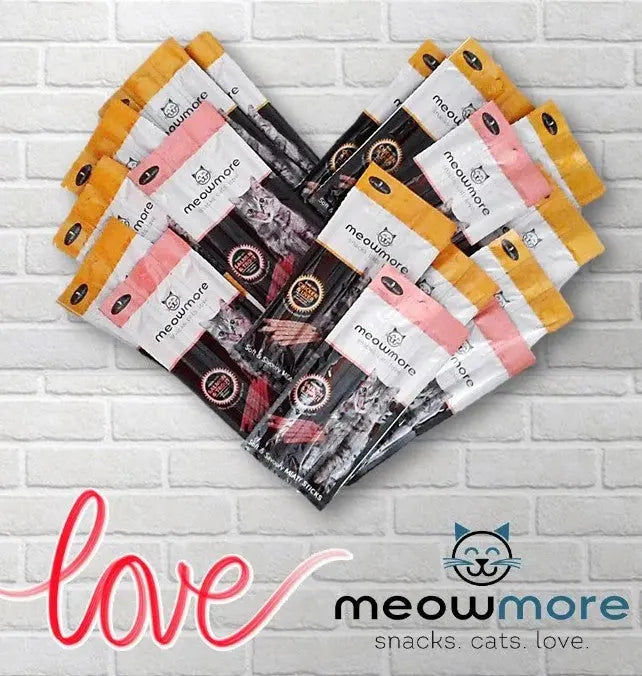 Meowmore snack bags arranged in a heart shape, showcasing love for cats and quality ingredients.