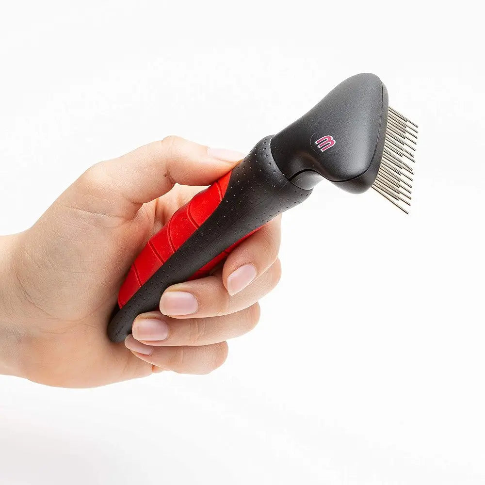 Pet grooming tool with a comfortable grip for effective de-shedding and removing loose fur.