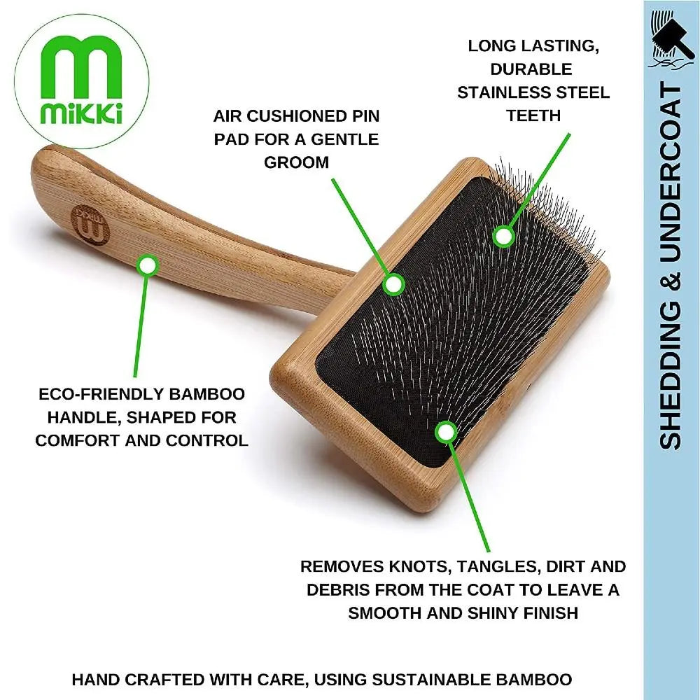 Eco-friendly bamboo pet brush with stainless steel teeth for gentle grooming and detangling.