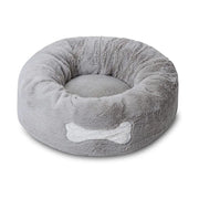 Cozy gray dog bed with plush fabric and a bone-shaped design for ultimate pet comfort.
