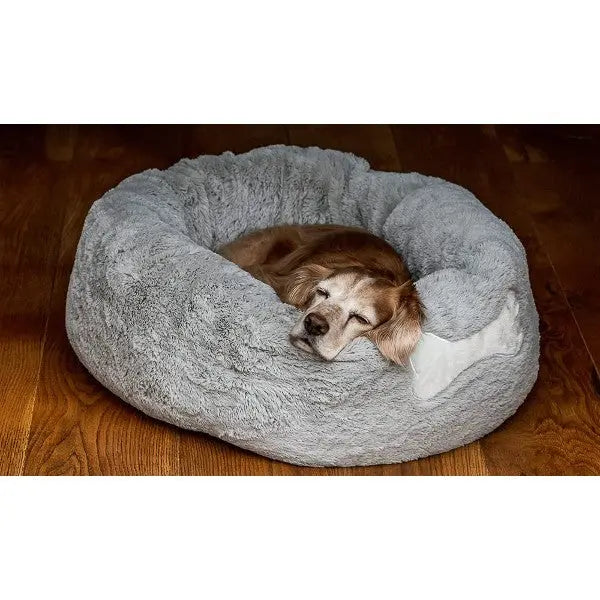 Cozy dog bed with a sleeping dog, perfect for comfort and relaxation.