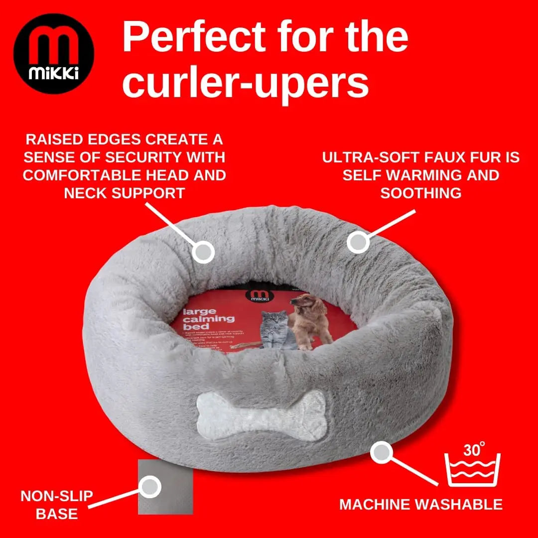 Cozy dog bed with raised edges for comfort, non-slip base, and machine washable ultra-soft faux fur.