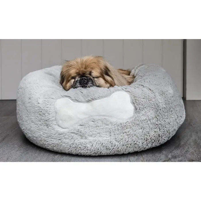 Cozy dog bed with a bone design, perfect for small pets to relax and sleep comfortably.