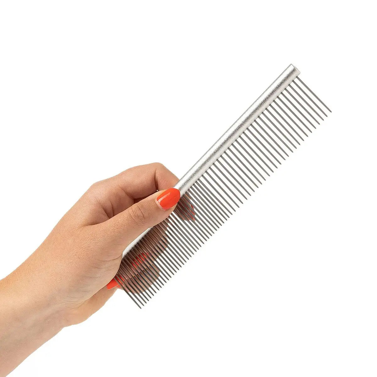 Hand holding a sleek metal comb with fine teeth for styling and grooming hair.