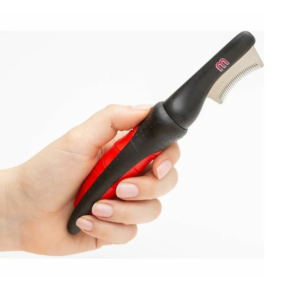 Pet grooming tool with ergonomic handle for effective de-shedding and fur removal.