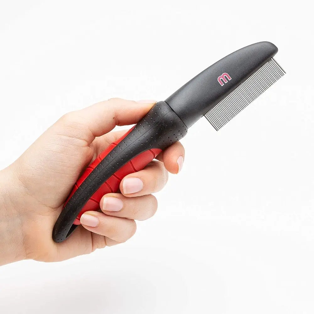 Pet grooming comb with ergonomic handle for effective fur detangling and removal of loose hair.