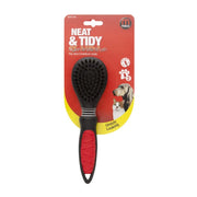 Nylon bristle brush for dogs and cats, designed for neat grooming and easy handling.