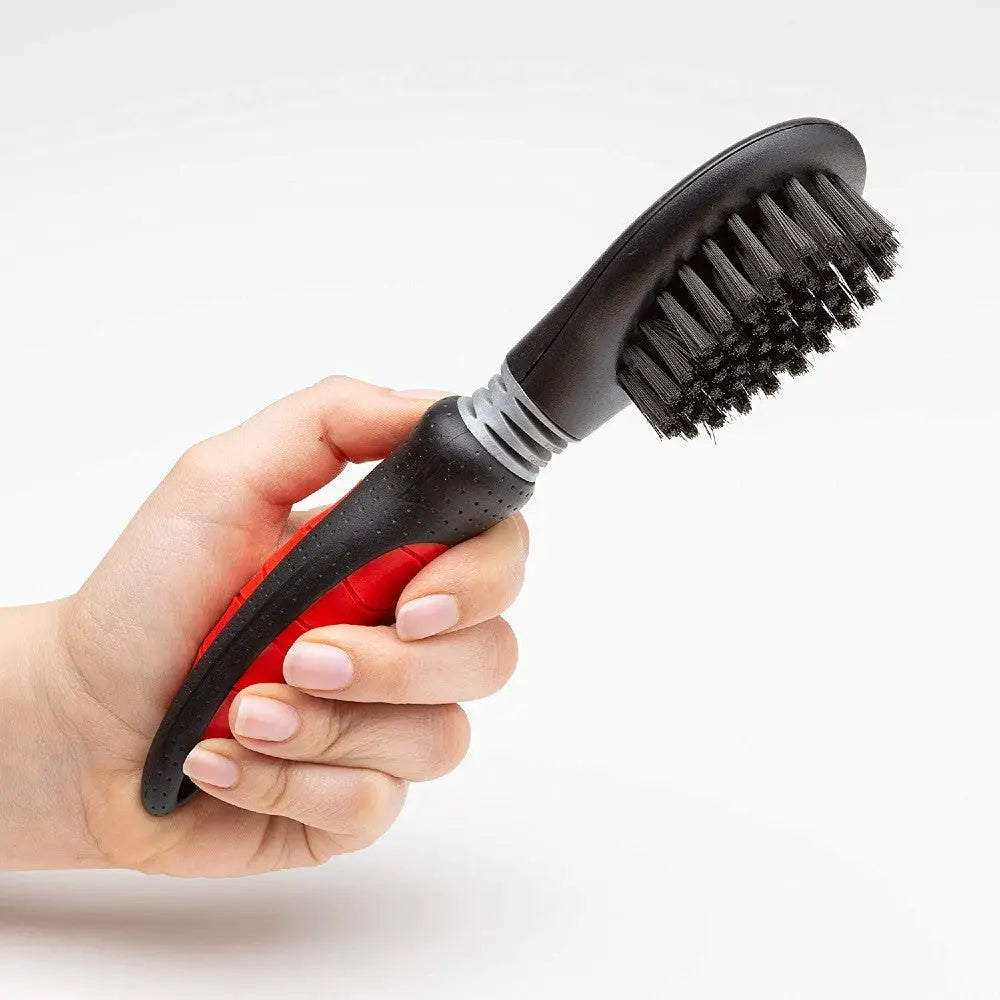 Pet grooming brush with ergonomic handle for effective fur removal and cleaning.