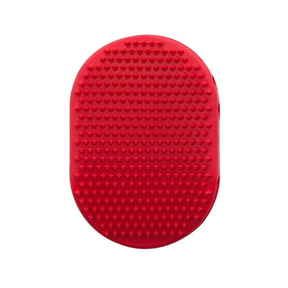 Red silicone grooming brush with textured surface for effective pet care and massage.