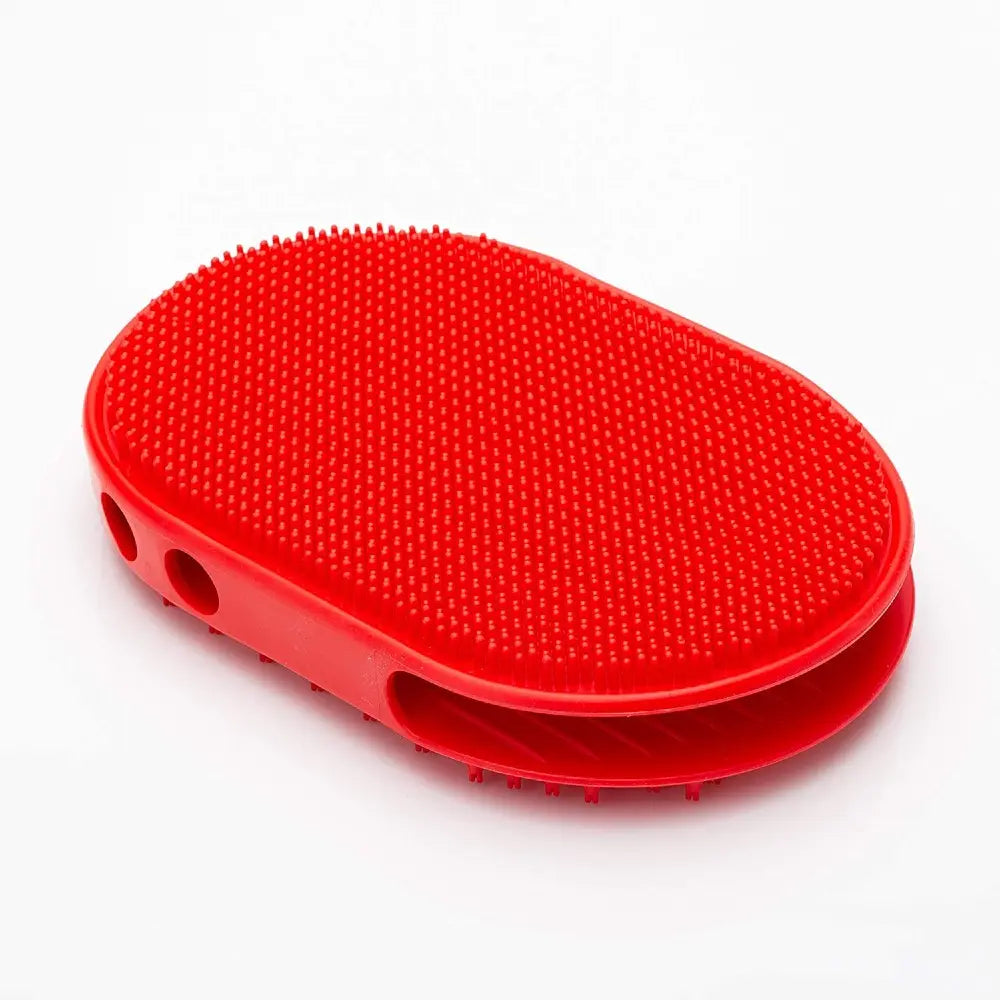 Red rubber grooming brush with textured surface for effective pet hair removal.