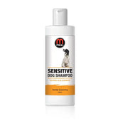 Sensitive dog shampoo with natural aloe and bamboo for gentle grooming.
