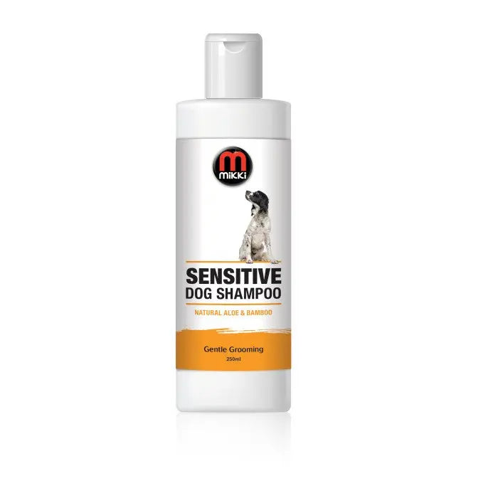 Sensitive dog shampoo with natural aloe and bamboo for gentle grooming.