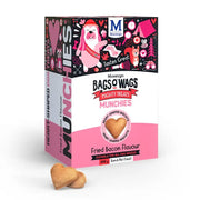 Heart-shaped dog treats in a colorful box, featuring bacon flavor and suitable for all dog breeds.