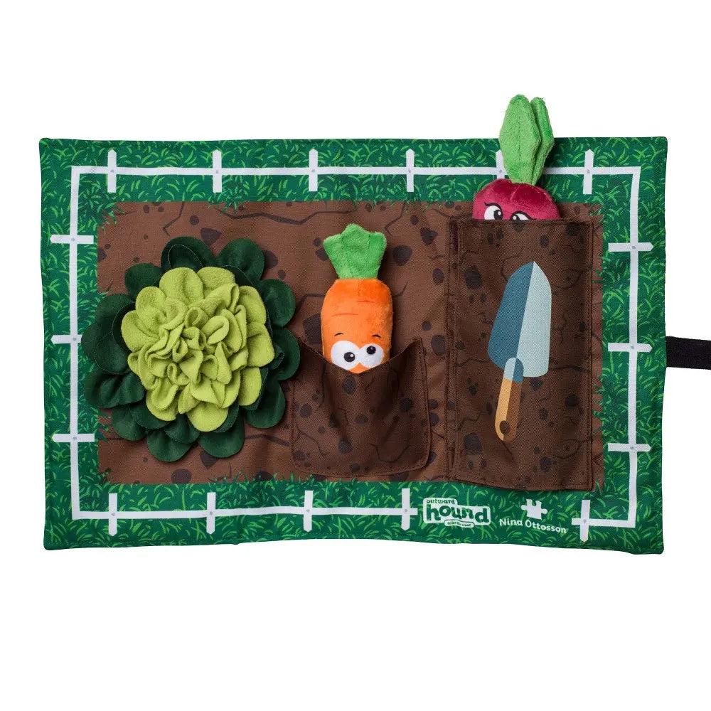 Interactive garden play mat with plush vegetables and gardening tools for imaginative play.