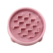 Pink slow feeder bowl with zigzag patterns for promoting healthy eating in pets.