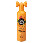 Pet Head orange deodorizing shampoo for dogs in a playful bone-shaped bottle.