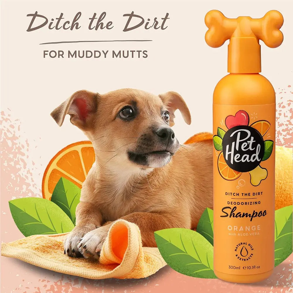 Pet Head orange shampoo for dogs, perfect for cleaning muddy pets with a fresh scent.