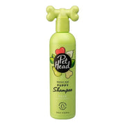 Pet Head Mucky Pup puppy shampoo in pear scent, featuring a playful bone-shaped cap.